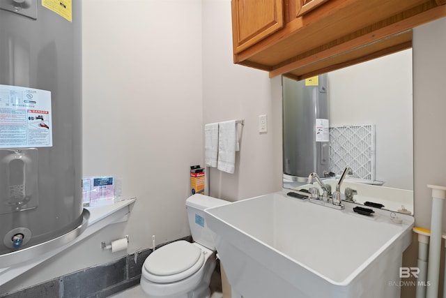 bathroom featuring toilet and a sink