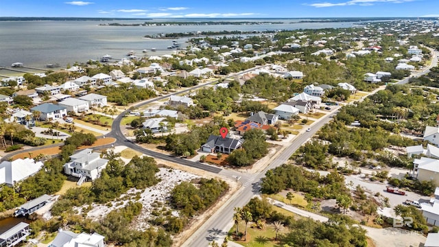 birds eye view of property featuring a residential view and a water view