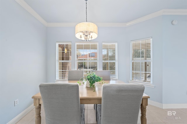 dining area with an inviting chandelier, light tile patterned floors, crown molding, and baseboards