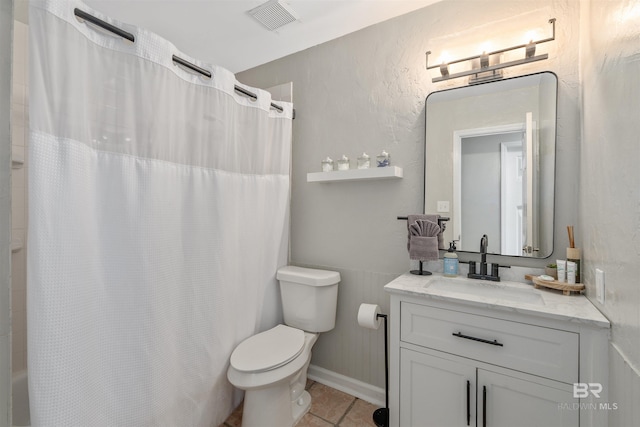 full bathroom with toilet, vanity, tile patterned floors, and shower / tub combo with curtain