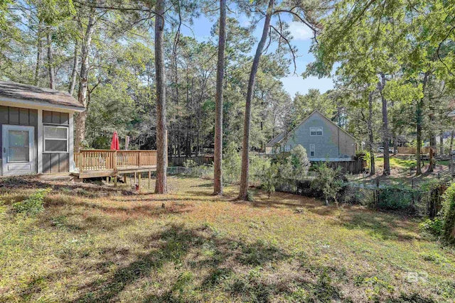 view of yard featuring a wooden deck