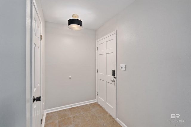 corridor featuring light tile patterned flooring