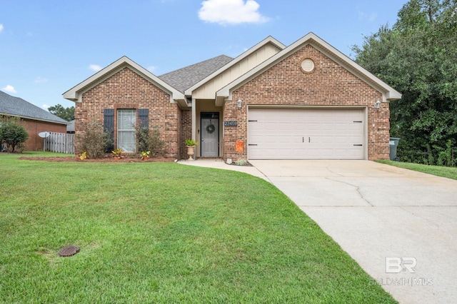 view of front of property featuring a front yard and a garage