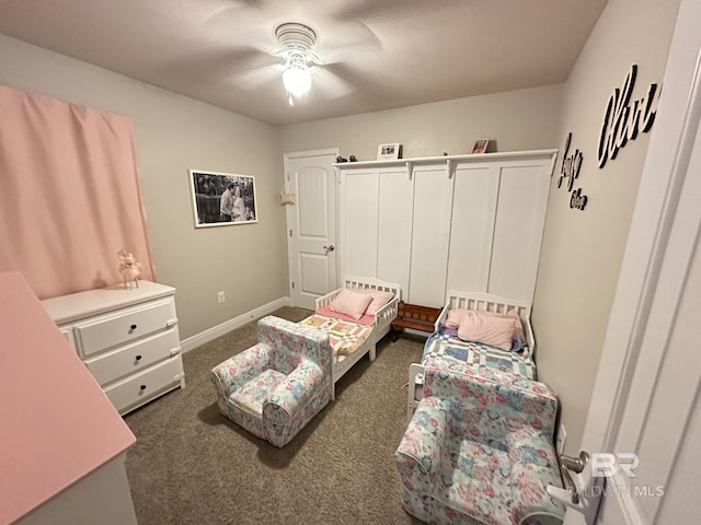 bedroom featuring dark colored carpet and ceiling fan