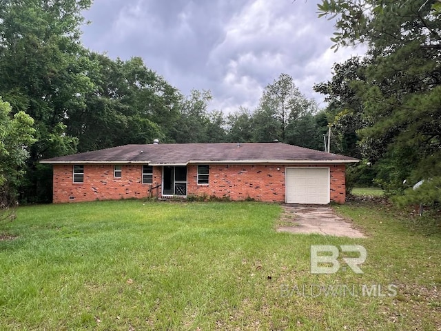 view of front facade with a garage, driveway, a front lawn, and brick siding