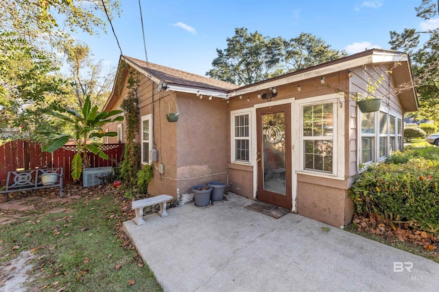 back of property with a patio area