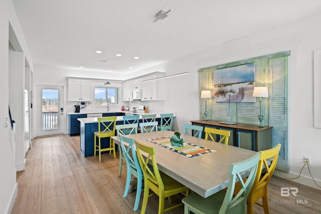 dining space with light wood-type flooring