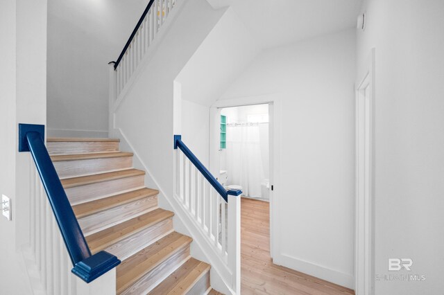 stairway featuring hardwood / wood-style flooring