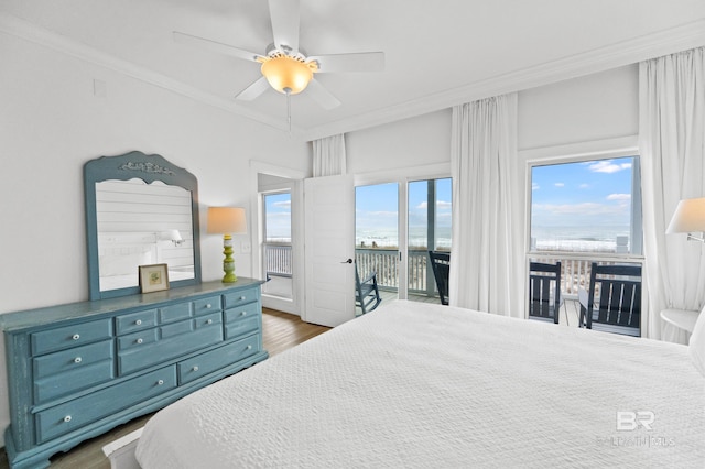 bedroom with crown molding, ceiling fan, dark hardwood / wood-style floors, and access to outside