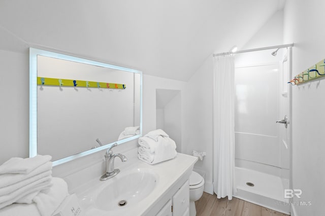 bathroom with vaulted ceiling, wood-type flooring, vanity, toilet, and a shower with curtain