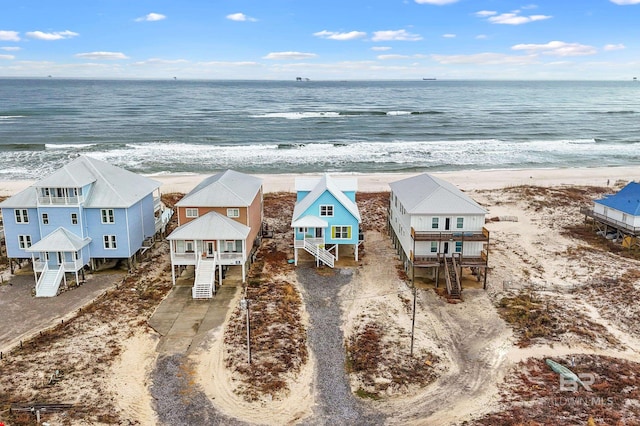 aerial view featuring a view of the beach and a water view