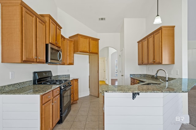 kitchen featuring sink, decorative light fixtures, kitchen peninsula, light stone countertops, and black gas range oven