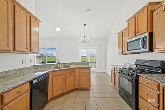 kitchen with black appliances, hanging light fixtures, an inviting chandelier, and a wealth of natural light