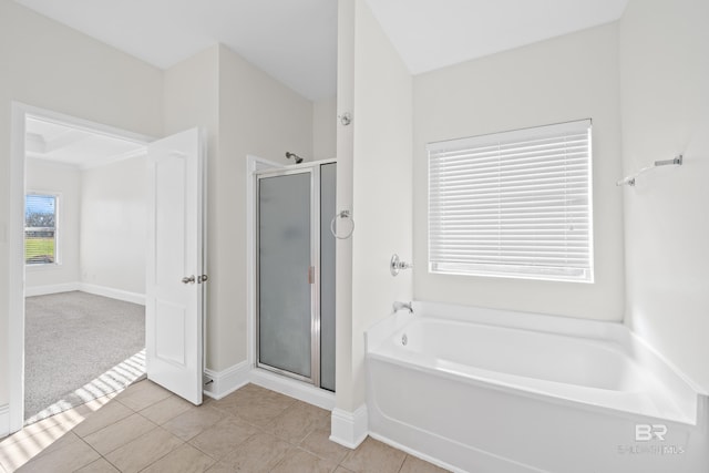 bathroom with tile patterned flooring and plus walk in shower