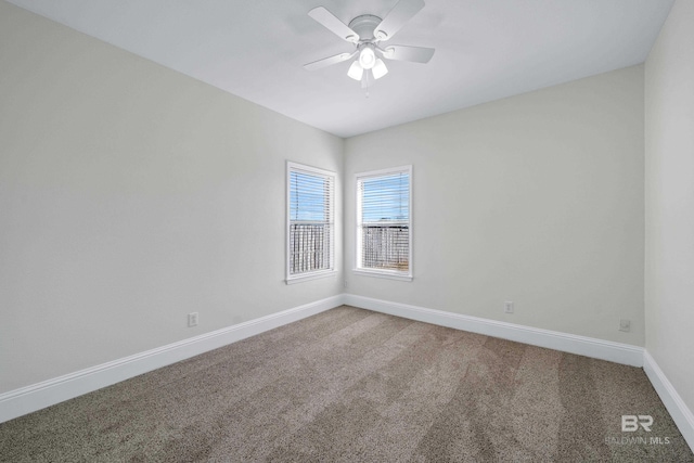 empty room featuring ceiling fan and carpet flooring