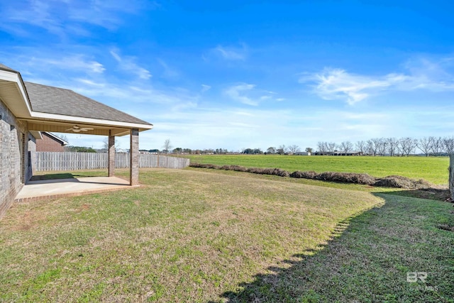 view of yard featuring a patio and a rural view