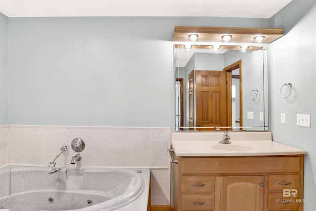 bathroom featuring vanity and a jetted tub
