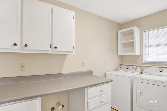 clothes washing area featuring cabinet space and washing machine and clothes dryer