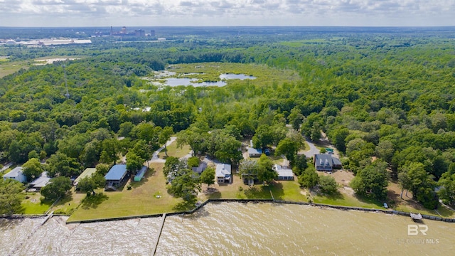 drone / aerial view with a water view and a wooded view