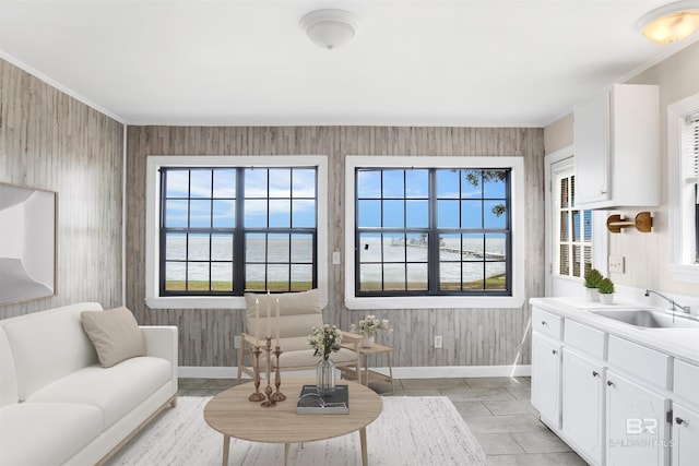 7411 Bay Rd, Mobile, AL 36605 - sitting room with baseboards, a water view, and light tile patterned floors