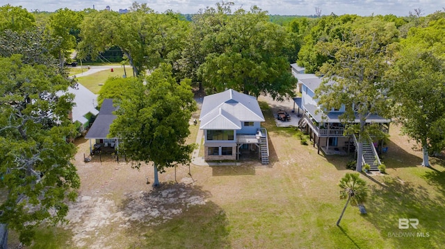 birds eye view of property with a wooded view