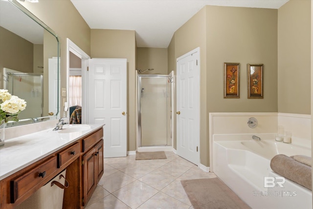 bathroom featuring shower with separate bathtub, tile patterned floors, and vanity