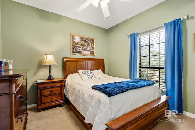 bedroom featuring ceiling fan and light carpet