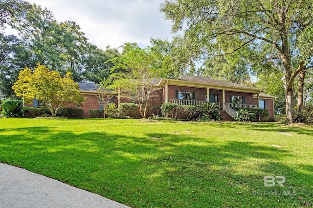 ranch-style home featuring a front yard