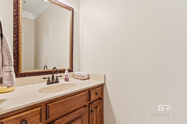 bathroom with crown molding and vanity