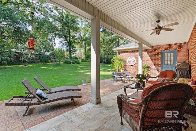 view of patio featuring ceiling fan