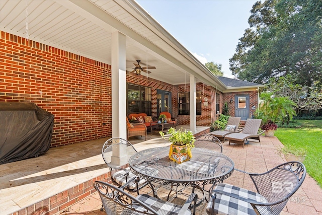 view of patio featuring ceiling fan and an outdoor living space