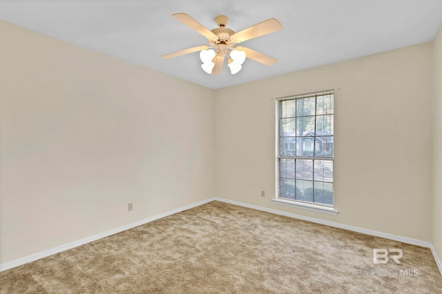 carpeted empty room with ceiling fan