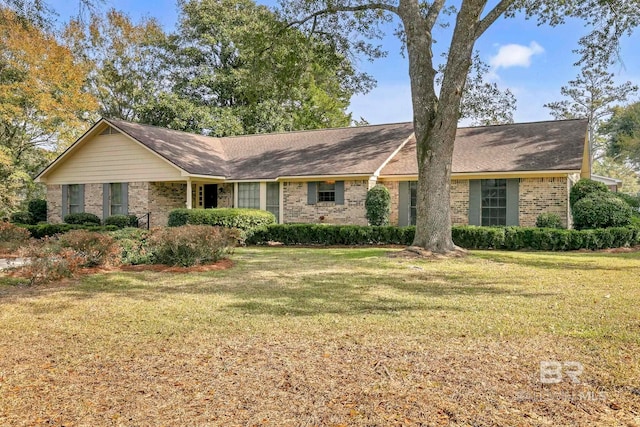 ranch-style home with a front lawn