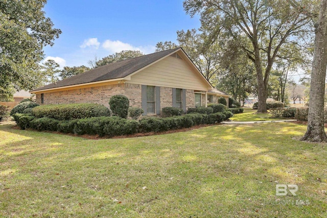 view of home's exterior featuring a lawn