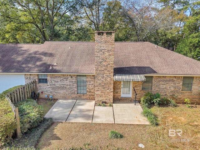 back of property with a patio area