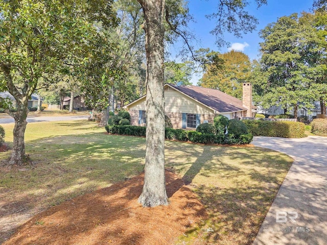 view of home's exterior featuring a yard