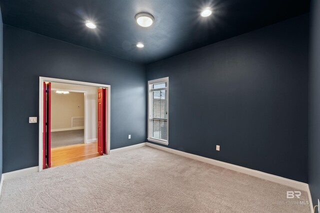 18971 Tralee Ct, Foley, AL 36535 - carpeted spare room with baseboards and recessed lighting