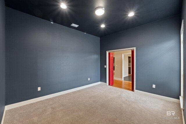 18971 Tralee Ct, Foley, AL 36535 - empty room featuring carpet flooring, baseboards, and recessed lighting