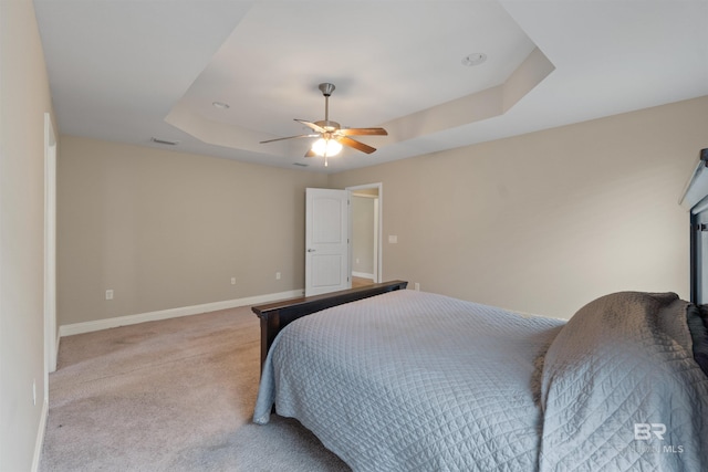 18971 Tralee Ct, Foley, AL 36535 - bedroom with a raised ceiling, carpet floors, baseboards, and a ceiling fan