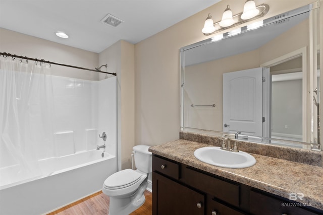 18971 Tralee Ct, Foley, AL 36535 - full bath with wood finished floors, toilet, vanity, and shower / bath combo with shower curtain