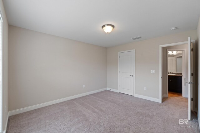 18971 Tralee Ct, Foley, AL 36535 - unfurnished bedroom with light carpet and baseboards