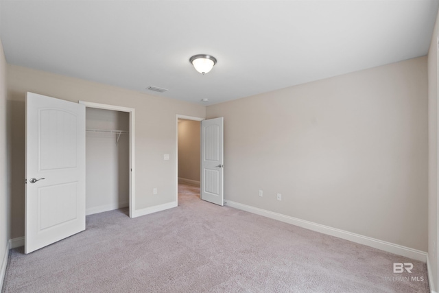 18971 Tralee Ct, Foley, AL 36535 - unfurnished bedroom featuring carpet, a closet, and baseboards