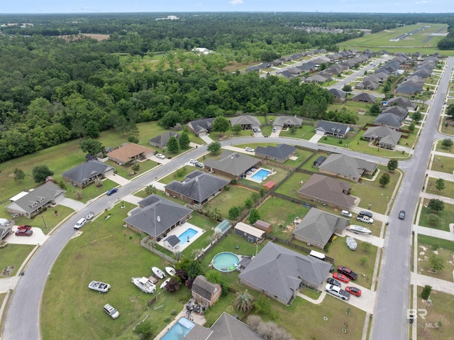18971 Tralee Ct, Foley, AL 36535 - aerial view of property's location featuring nearby suburban area and a forest
