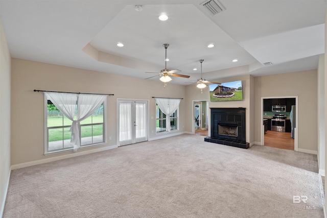 18971 Tralee Ct, Foley, AL 36535 - unfurnished living room featuring carpet, ceiling fan, baseboards, a tile fireplace, and recessed lighting