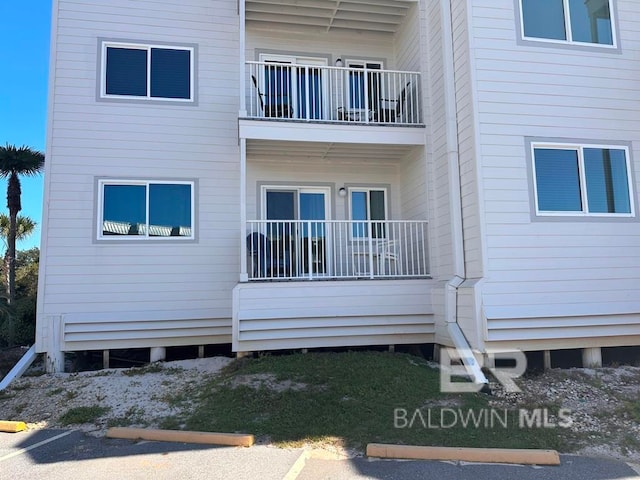 rear view of house with a balcony