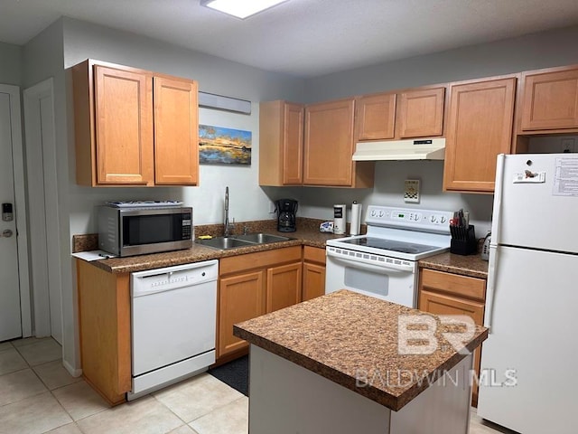 kitchen featuring sink, white appliances, and light tile patterned floors