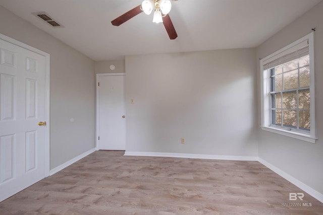 unfurnished room with light hardwood / wood-style floors and ceiling fan