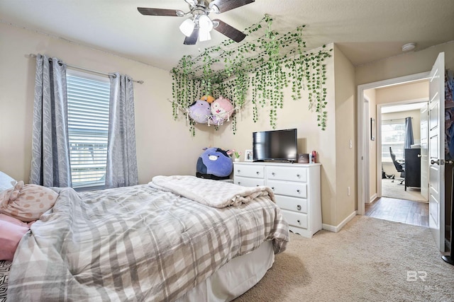 24189 Harvester Dr, Loxley, AL 36551 - bedroom featuring light carpet and ceiling fan