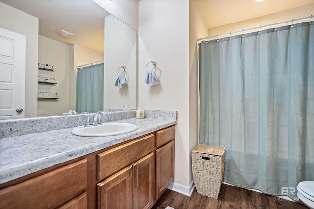 24189 Harvester Dr, Loxley, AL 36551 - full bathroom with wood finished floors and vanity