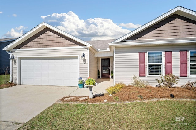 24189 Harvester Dr, Loxley, AL 36551 - view of front of home featuring concrete driveway, an attached garage, and a front yard